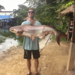 Cameron holding a big fish in BoSang Fishing Park, Thailand