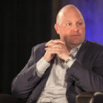 Marc Andreessen sitting in a black armchair