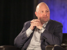 Marc Andreessen sitting in a black armchair