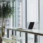 Turned off laptop on top of brown wooden table photo