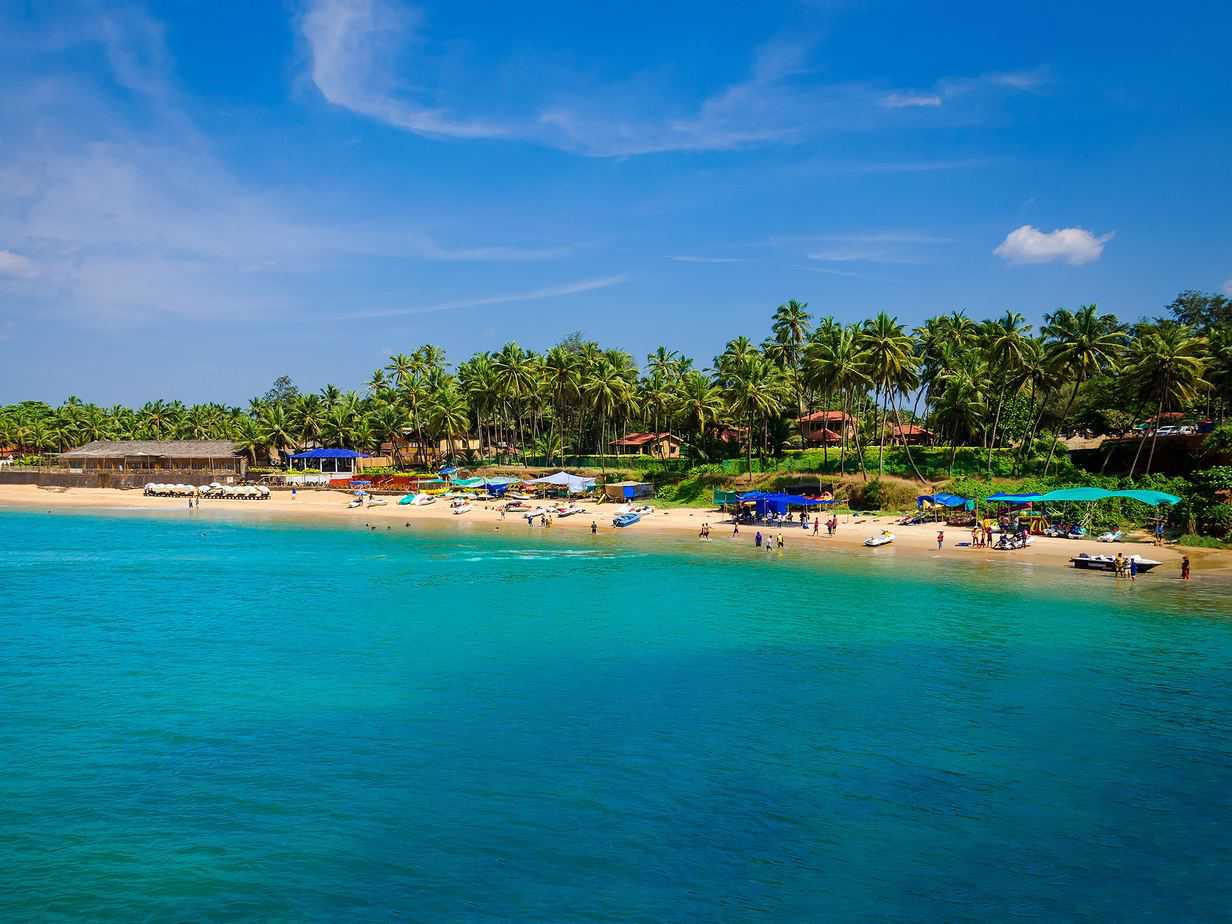 blue body of water under sunny sky in GOA, India