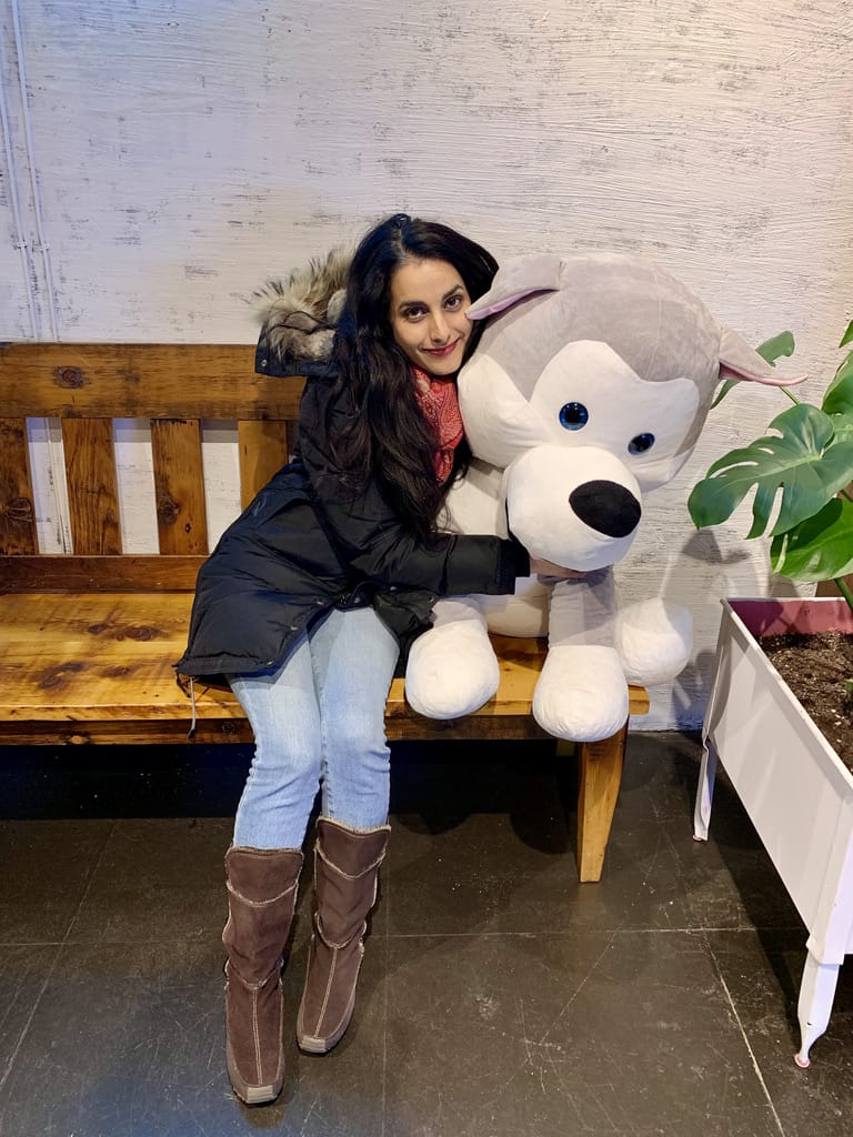 Amna with a stuffed animal