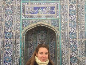 Rachel Coleman in Uzbekistan in front mural art