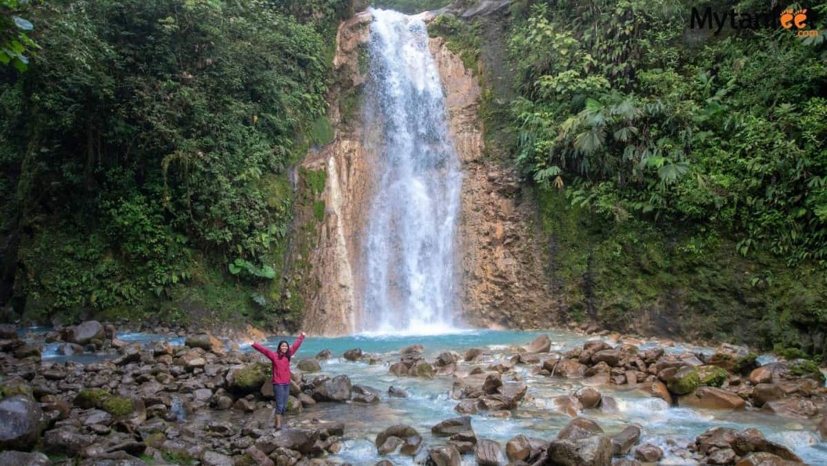 Samantha with a waterfall in Costa Rica