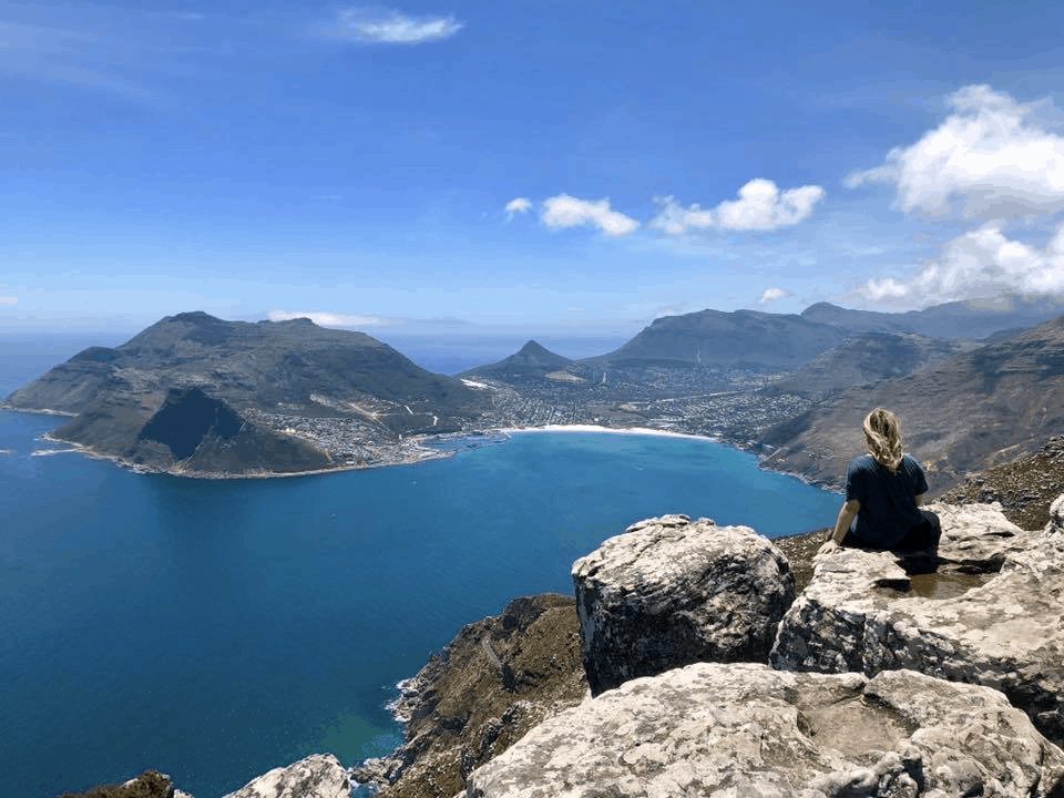 Ali Greene sitting next to a lake