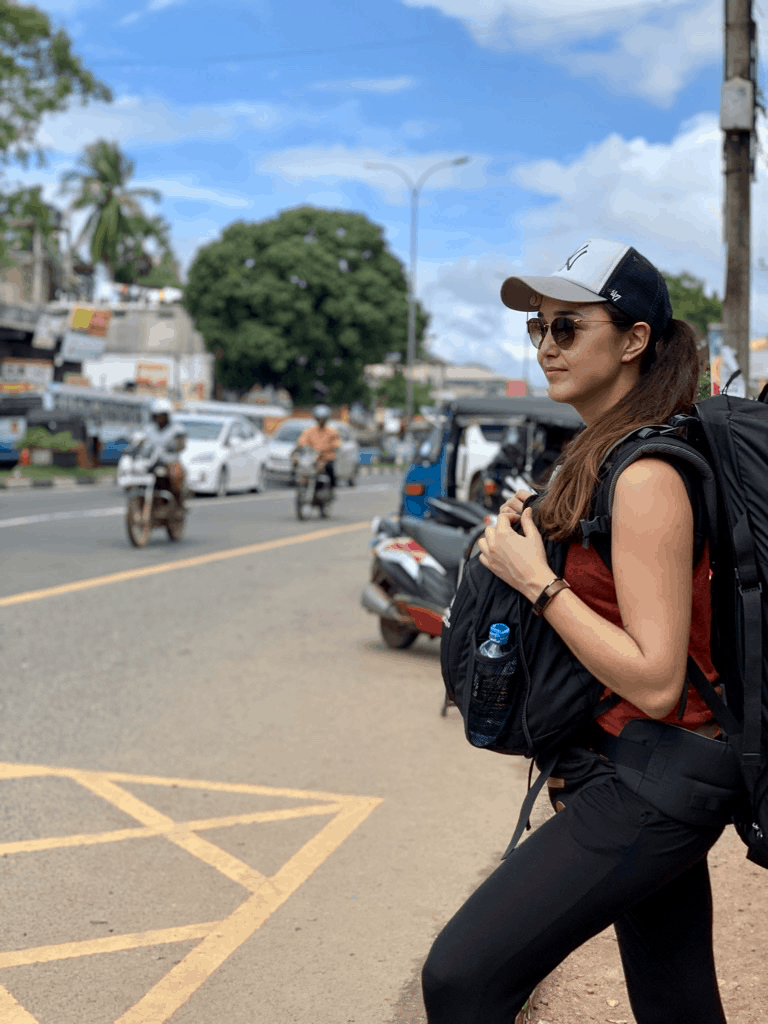 Valerie can with her backpack on the road