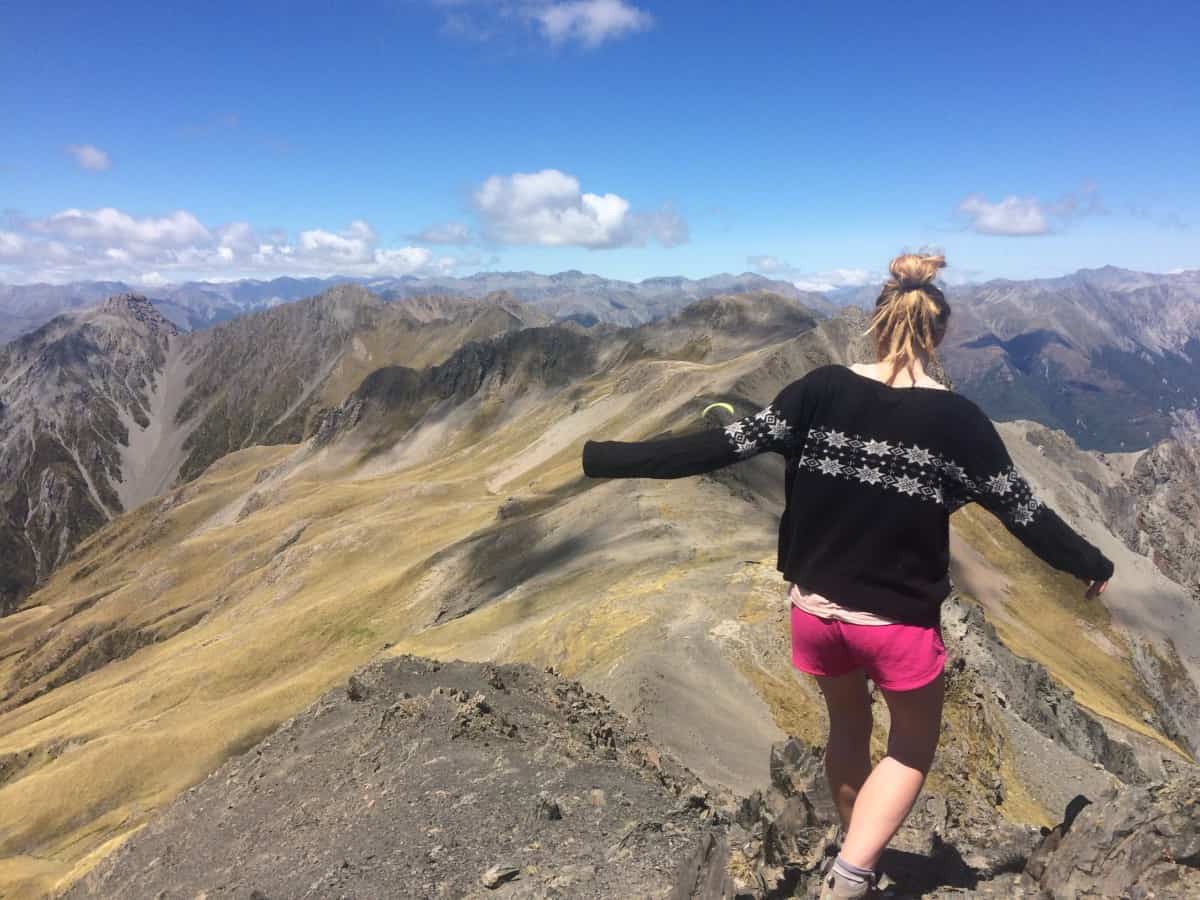 Kelly Diggle hiking on a mountain