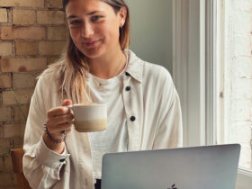 Lucy Johnson with her computer and coffe