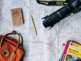 Camera, pencil, bag, books and notepad on top of Salisbury District, England