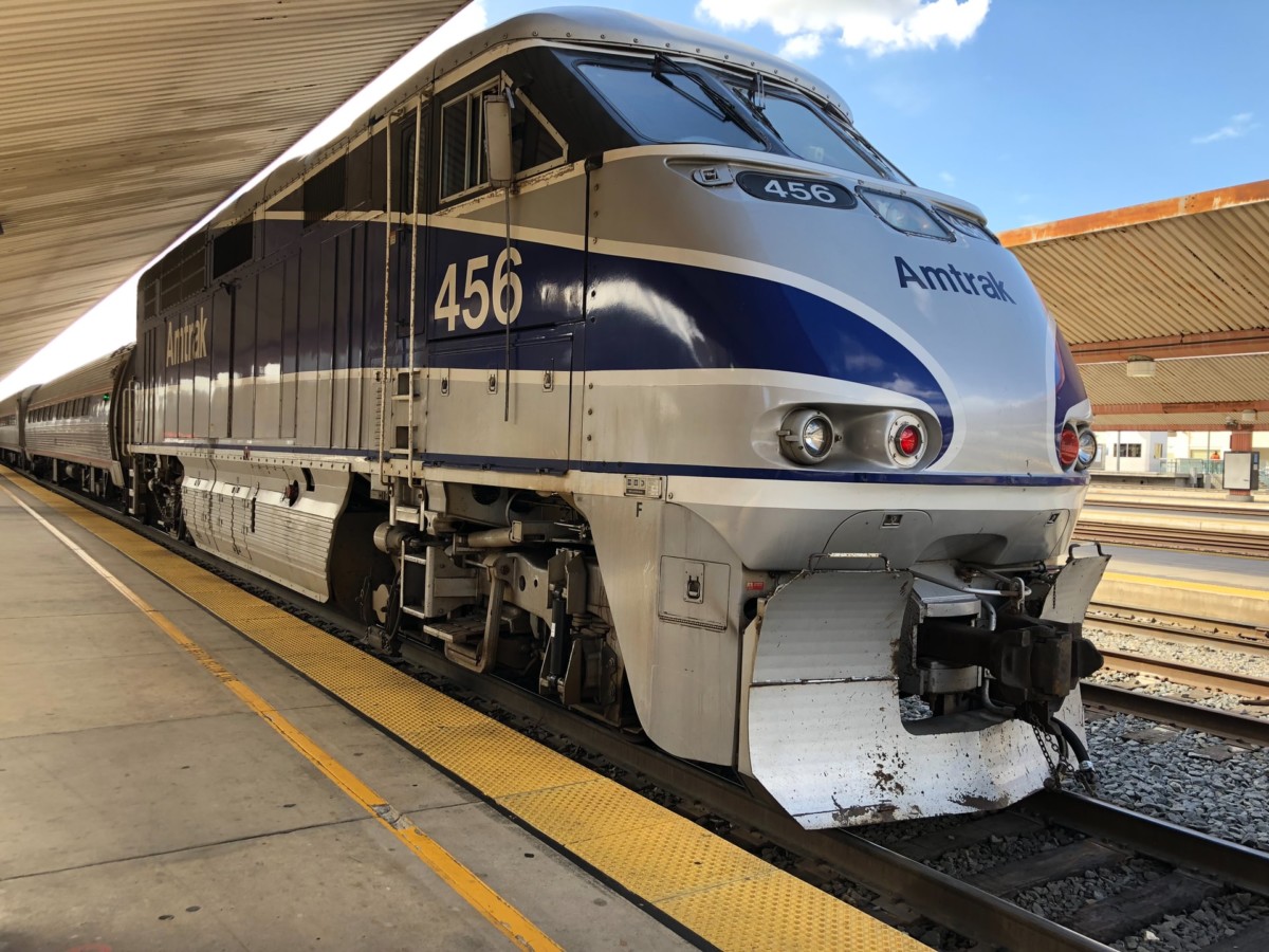 An Amtrak train stopped at a station