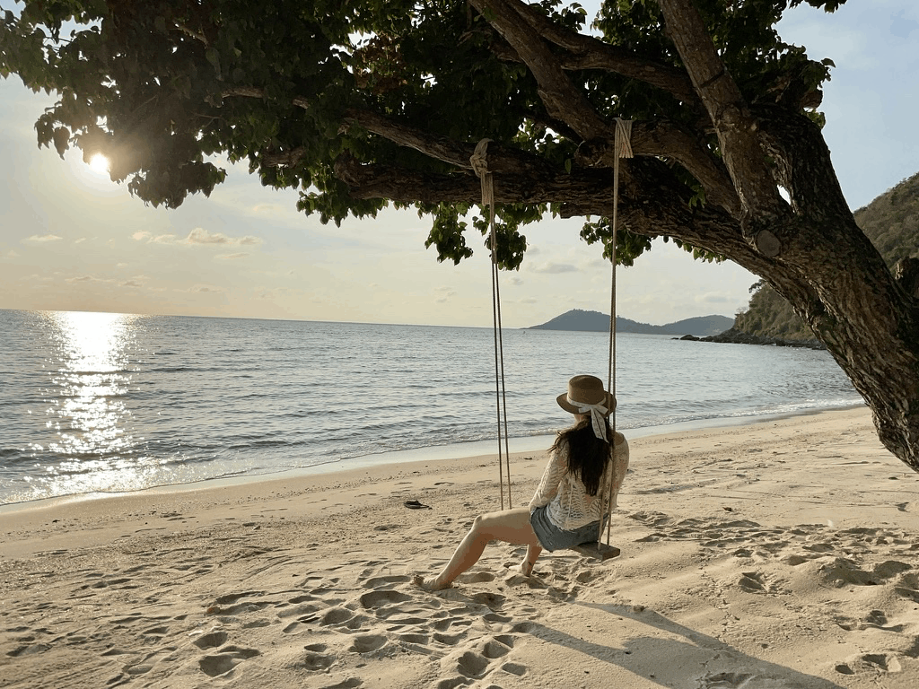 Valerie on a beach swing