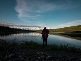 Man standing in front of body of water