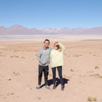 Tom and Laura huging each other in the desert