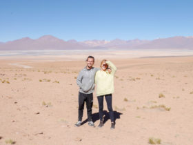 Tom and Laura huging each other in the desert