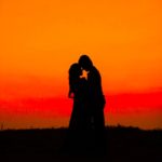 Silhouette of man and woman during sunset photo