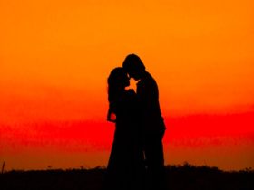 Silhouette of man and woman during sunset photo