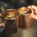 A couple holding their mugs before drinking