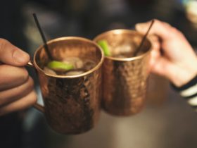 A couple holding their mugs before drinking