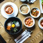 Multiple dishes field bowls on wooden table