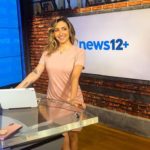 Michelle Marie smiling in news12+ while wearing a pink dress