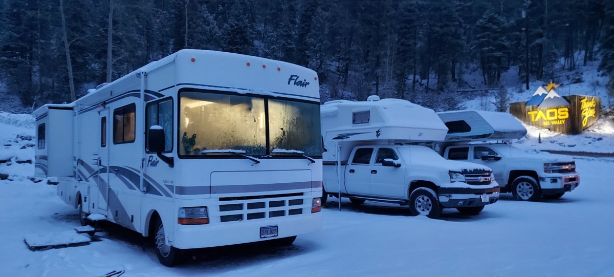 Julie Singh's RV parked in Taos, New Mexico in the snow with other RVs parked near it