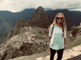 Anny Wooldridge standing in front of a part of Machu Picchu in Peru