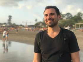 Michael Alexis smiling on a beach in Bali