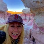 Angela Faith Martin smiling in front of colorful rock formation