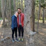 Becca and Brandon together in the woods while wearing warm clothing