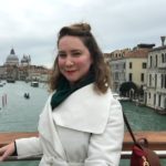 Kathleen O'Donnell posing in front of the lake of Amsterdam