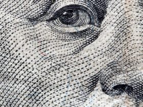 Close up of Benjamin Franklin's face on the 100 dollars bill