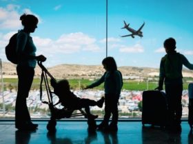 A mom and three kids at the airport