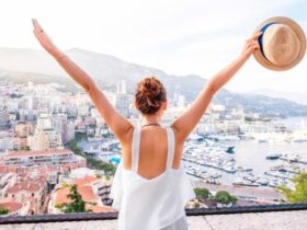 Young female traveler enjoying the great view of the city and harbor of Monte Carlo, Monaco