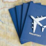 Toy airplane on top of a stack of passports