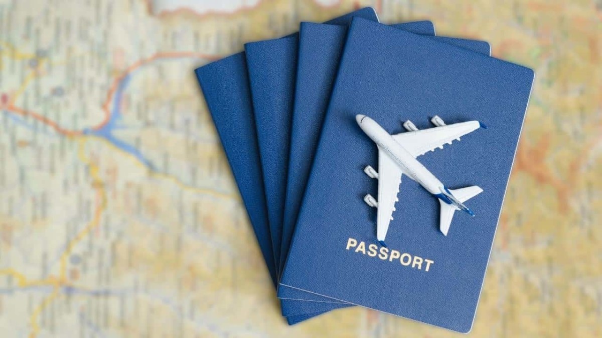 Toy airplane on top of a stack of passports