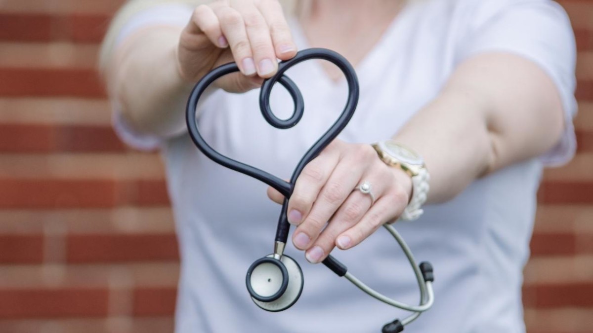 Nurse shaping the stethoscope wires into a heart